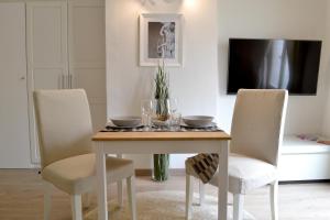 A television and/or entertainment centre at Modarno Exclusive Apartments