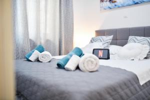 Posteľ alebo postele v izbe v ubytovaní Serenity Apartment