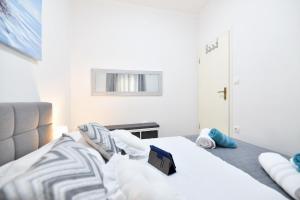 Posteľ alebo postele v izbe v ubytovaní Serenity Apartment