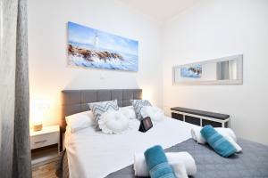 Posteľ alebo postele v izbe v ubytovaní Serenity Apartment
