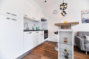 Kuchyňa alebo kuchynka v ubytovaní Serenity Apartment + 14 fotografií