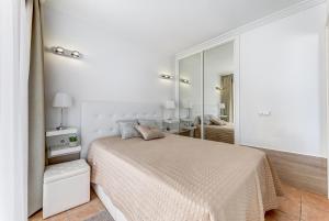 A bed or beds in a room at Windsor Panoramic Las Americas