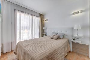 A bed or beds in a room at Windsor Panoramic Las Americas