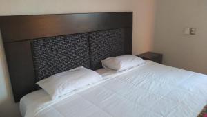 Postel nebo postele na pokoji v ubytování Hotel Kinich Ahau