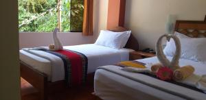 Voodi või voodid majutusasutuse Hostal Vista Waynapata 123 toas