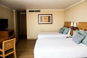 Voodi või voodid majutusasutuse Hotel Mirabel toas