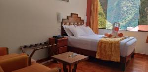 Voodi või voodid majutusasutuse Hostal Vista Waynapata 123 toas