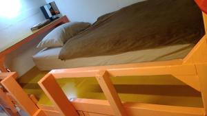 Letto o letti in una camera di Holiday House Ryukyu-an "MUSIC HOSTEL"