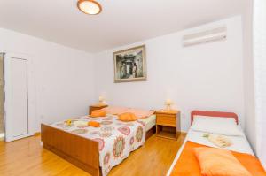 Postel nebo postele na pokoji v ubytování Apartments and Room Sun & Sea