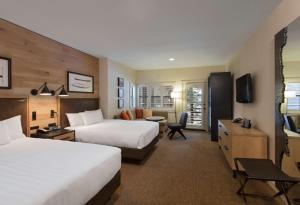 a hotel room with two beds and a television at Hyatt Regency Lake Tahoe Resort, Spa & Casino in Incline Village