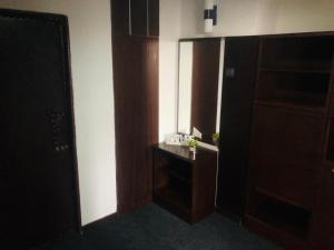 a small bathroom with a sink and a mirror at Hotel Koldum in Litvínov