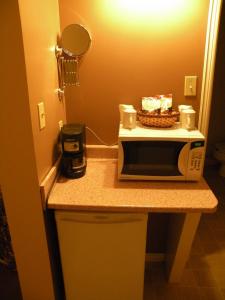 a microwave sitting on a counter in a room at Hawberry Motel in Little Current