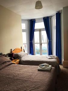 A bed or beds in a room at Haydee Guesthouse 