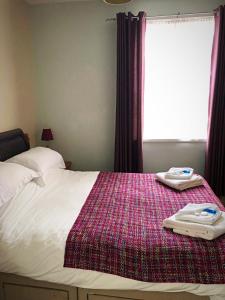 A bed or beds in a room at Haydee Guesthouse 