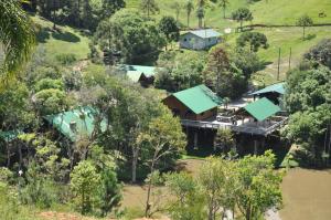 an aerial view of a house in the trees at Capivari Ecoresort in Campina Grande do Sul