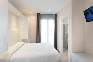 Posteľ alebo postele v izbe v ubytovaní White Suite & Apartments