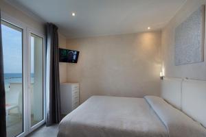 Posteľ alebo postele v izbe v ubytovaní White Suite & Apartments