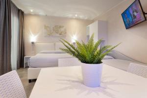Posteľ alebo postele v izbe v ubytovaní White Suite & Apartments
