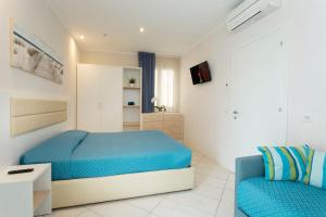 Posteľ alebo postele v izbe v ubytovaní White Suite & Apartments