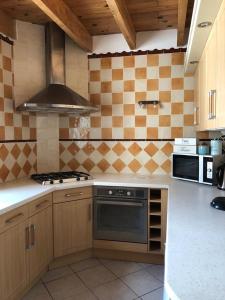 a kitchen with a stove and a stove top oven at Bellevue in Saintes-Maries-de-la-Mer