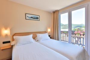 Postel nebo postele na pokoji v ubytování Apartamentos Mundaka