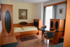 Postel nebo postele na pokoji v ubytování Hotel Das Schlössl