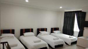 Postel nebo postele na pokoji v ubytování Hotel Mutiara KGMMB, Melaka