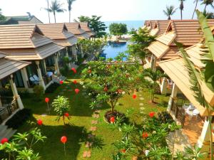 an aerial view of a resort with a pool at Poolsawat Villa - SHA Plus in Lamai
