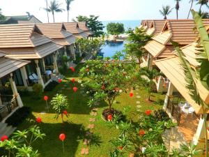 an aerial view of a resort with a pool at Poolsawat Villa - SHA Plus in Lamai