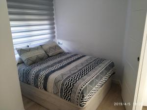 Posteľ alebo postele v izbe v ubytovaní Apartamento en urbanización Algaida en primera línea de playa + 6 fotografií