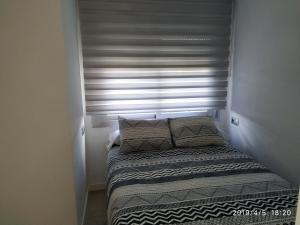 Posteľ alebo postele v izbe v ubytovaní Apartamento en urbanización Algaida en primera línea de playa
