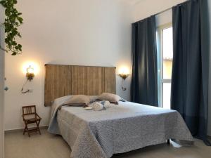 Tempat tidur dalam kamar di Appartamenti Milù