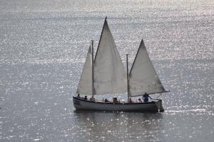 a group of people on a sail boat in the water at Ferienwohnung Kisajno in Giżycko