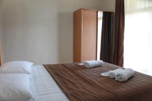 Ένα ή περισσότερα κρεβάτια σε δωμάτιο στο Guest House Maradona