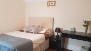 Postel nebo postele na pokoji v ubytování Arman Lodge House