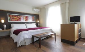 Cama ou camas em um quarto em Plaza Paradiso Petit Hotel