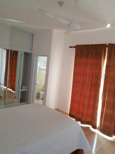 Postel nebo postele na pokoji v ubytování Apartamentos Nuevo Amanecer