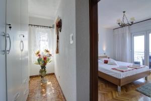 Postel nebo postele na pokoji v ubytování APARTMENT LUCA