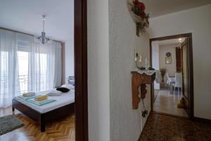 Postel nebo postele na pokoji v ubytování APARTMENT LUCA
