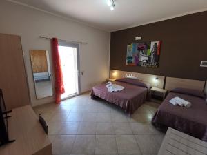 Postel nebo postele na pokoji v ubytování Samanà B&B con Spiaggia Privata a Punta Prosciutto