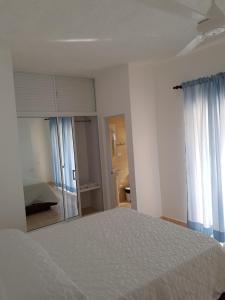 Postel nebo postele na pokoji v ubytování Apartamentos Nuevo Amanecer