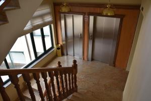 an overhead view of a hallway with two doors at Hotel Ele Puente Romano de Salamanca in Salamanca +66 photos