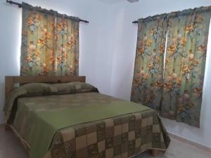 Postel nebo postele na pokoji v ubytování Apartamentos Nuevo Amanecer