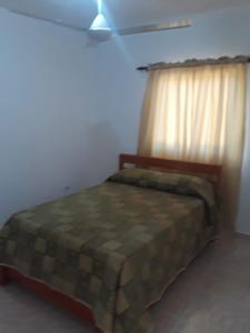 Postel nebo postele na pokoji v ubytování Apartamentos Nuevo Amanecer