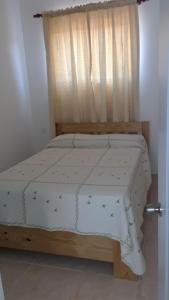 Postel nebo postele na pokoji v ubytování Apartamentos Nuevo Amanecer