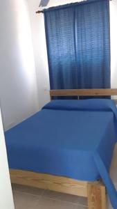 Postel nebo postele na pokoji v ubytování Apartamentos Nuevo Amanecer
