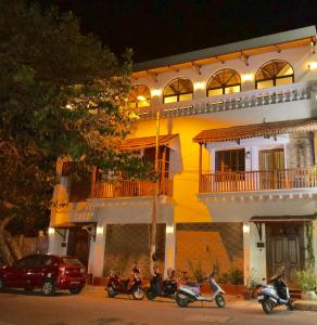 a group of motorcycles parked in front of a building at La Maison Pondichéry in Pondicherry