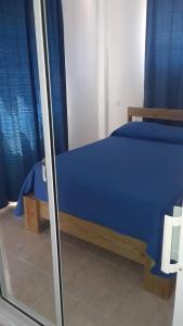 Postel nebo postele na pokoji v ubytování Apartamentos Nuevo Amanecer
