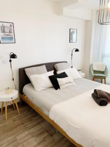 Llit o llits en una habitació de Appart Hôtel Cézanne