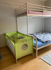 a childs bunk bed with a play set in a room at Apartament BalticPark Stegna in Stegna